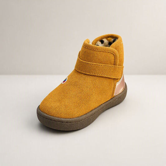 Brown suede ankle boots for kids with leopard fur lining, silver buckle, and chunky sole