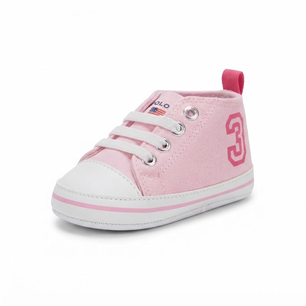 A pink canvas high-top baby shoe with white laces, a white rubber toe cap, and a pink pull tab, featuring a pink number 3 on the side.