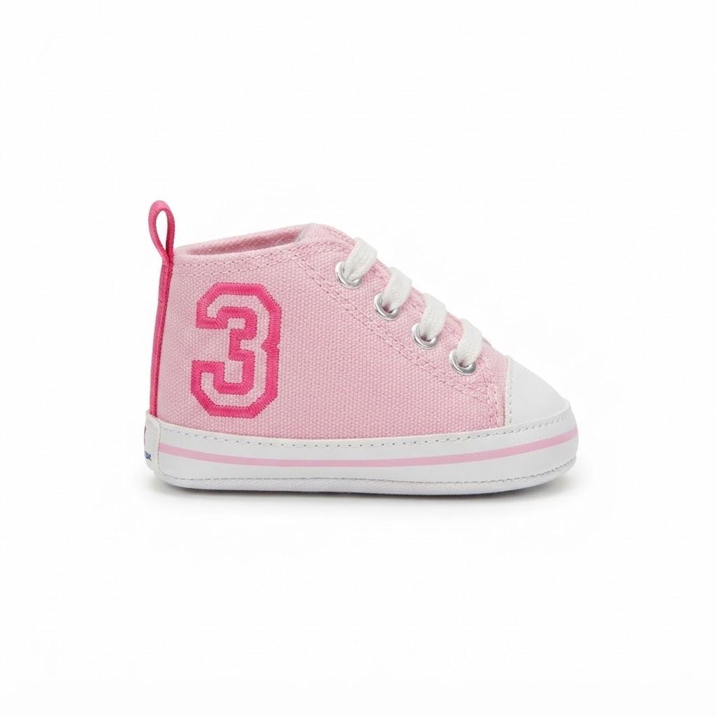 A pink canvas baby high-top sneaker with a large pink number 3 on the side, white laces, and a white rubber toe cap and sole, shown against a plain white background.