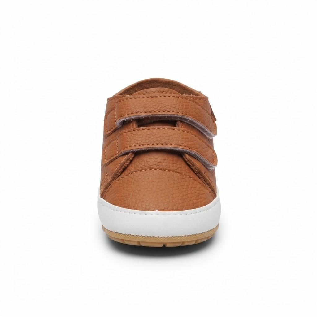 A single toddler sneaker shown from the back, featuring a textured brown upper with two hook-and-loop straps and a white midsole.