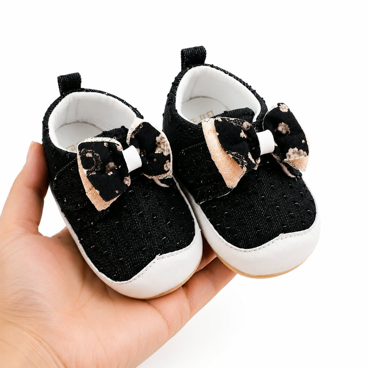Cute black denim baby sneakers with large bow and white dots for infants and toddlers, soft anti-slip sole