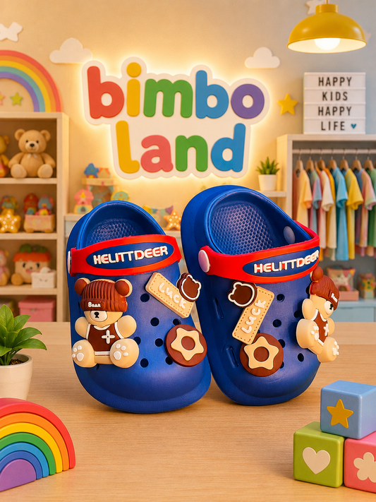 A pair of blue clog-style shoes with red straps and decorative charms, displayed on a wooden surface in a colorful children's room setting with toys, shelves, and a sign reading 'bimbo land' and 'HAPPY KIDS HAPPY LIFE'.
