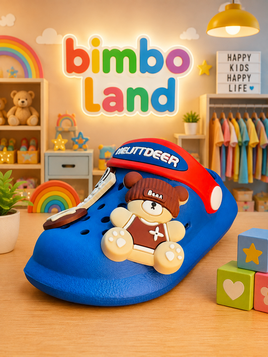A blue clog-style shoe with a red top and a teddy bear decoration, shown in a colorful children's room setting with the text 'bimboLand' in the background.