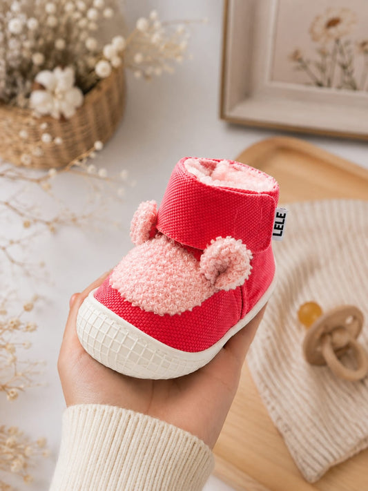 Cute red high-top baby first-walker shoes with fluffy pink teddy ears, secure velcro strap, and white non-slip rubber sole.